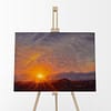 Whispy Warm Sun Sky Oil Painting of the sunrise by Andrew Gaia on easel